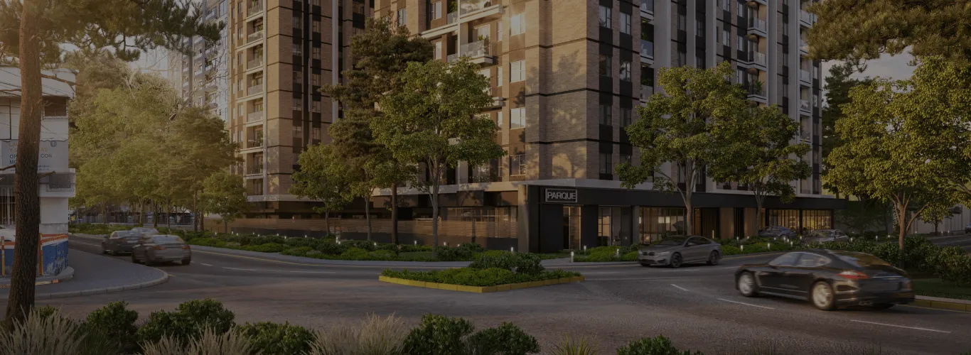 Render exterior de Parque Vista Verde desde la avenida, con el ingreso al proyecto y las torres de apartamentos en Zona 15